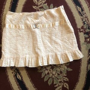 Cream eyelet Mini Skirt with Ruffled Hem with lining. 30” around 30” length.used